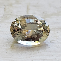 Natural untreated oval neutral color very pale yellow sapphire.   This super brilliant Tanzanian sapphire is from the Umba River region of Africa. The color of this well cut unheated sapphire is very unique yet very typical of the Umba region as it h