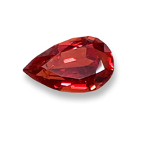 Genuine pear shape untreated orange sapphire from Africa.  This unheated sapphire has a deep orange color with flashes of gold.