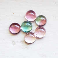 This rare tourmaline parcel of 7mm round cabochons have an assortment of colors including baby pink, bubble gum pink, seafoam blue green and a bi-color watermelon color. These clean and untreated Maine tourmalines are sold as a 6 stone lot 9.45 ct tw.