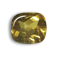 This lively buff-top cushion shape natural untreated chartreuse yellow sapphire is from the Umba River region in Tanzania.  This cabochon top and faceted bottom rich greenish yellow sapphire has an earthy sun kissed color palette and is cut in a way 