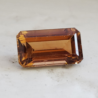 Lively emerald-cut gold tourmaline.  This untreated gold tourmaline from Mozambique is a well cut rectangle e/c and very unique.