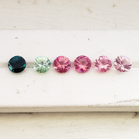 Diamond-cut Maine tourmaline parcel of 6 mm rounds  showcasing bright colors of mint green, teal green, light pink, morganite pink and deep pink. These untreated round Maine tourmalines are well cut and sold as a 6 stone suite 4.69 ct tw.