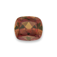 Natural cushion unheated orange sapphire from the Umba River Valley in Africa.  This orange sapphire has notes of cognac with gold and brown undertones.  This untreated orange sapphire is well cut bright and lively. 