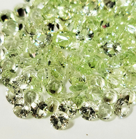 Loose round light green grossular garnet melee. These brilliant and super bright untreated grossular garnets range in color from very light green to minty green and available in sizes starting a 2.5 mm and up to 3.5 mm.