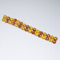 Rare untreated orange sapphire and yellow sapphire 2.8 millimeter 32 gemstone 4.59 carat total weight  round cabochon suite.  This unique 2 color sapphire suite would be perfect for a custom band, ring or earrings.