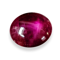 Nice rich red oval star ruby cabochon with pinkish star.