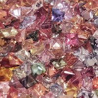 Multi color untreated sapphire in princess cut squares. These square sapphires are natural untreated sapphires and come in many earthy colors and organic shades such as pastel pinks, rose sapphires, baby blue sapphires, peach sapphires, gray sapphires, ma