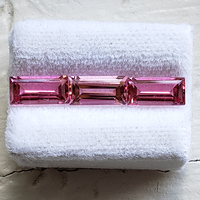 This pink Maine tourmaline baguette suite is step-cut in size 8 x 4. The natural untreated  pink tourmaline baguettes are lively and bright. Nice larger size baguettes sold as a 3 stone lot 2.43 ct tw.