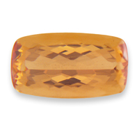 Large elongated cushion untreated precious topaz.  Beautiful golden peach color topaz with golden undertones could also be considered to be a barrel shape topaz.  Excellent clarity.  Would make a nice large topaz center stone for a precious
