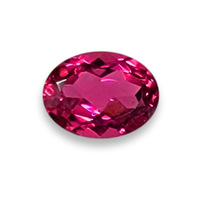 Oval Rubellite tourmaline with hues of purple/magenta shades and flashes or fuchsia.
