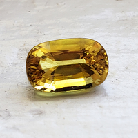 Lively antique cushion yellow sapphire.  This yellow sapphire has a flashes of chartreuse color.  Lots of life in the cushion shaped yellow sapphire.