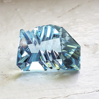 Lively fancy shape custom cut aquamarine with nice true aqua blue color. This almost 7 carat  large fantasy cut aquamarine would make a unique custom pendant or ring.