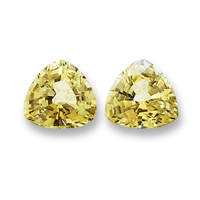 Matching pair of 5 mm trillion light lemon yellow sapphires. This pair of 5 millimeter yellow sapphire trillions are clean and full of life. This would be a perfect triangle yellow sapphire pair as side stones for a ring or beautiful yellow sapphire earri