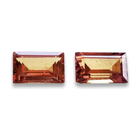 Pair of unheated baguette orange sapphires from the Umba River Valley in Africa. These lively rectangle pair of sapphires are very bright with orange peach tones.