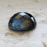 Rare 11 x 9 oval untreated organic teal sapphire rose cut.  This rose cut sapphire is well cut with a completely flat bottom and checkerboard style facets on its cabochon dome top.  Unique color sapphire as it picks up tones of blues, greens, grays!