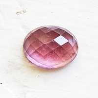 This 9 x 7 mm oval rose cut pink tourmaline is a pretty rose pink color, clean and well cut.