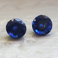 Pair of round blue sapphires with slightly darker rich undertones. This matched pair of 5.2 mm blue sapphires rounds would be perfect for stud earrings.