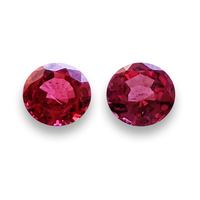 Matched pair of lively round red spinels with sparkling ruby red and pink undertones. This pair of spinels perfect as side stones or in earrings. 