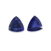 Lovely pair of trillion blue sapphires with a rich deep blue tone.  This pair has no visible inclusions to the eye and would be perfect as accent stones.