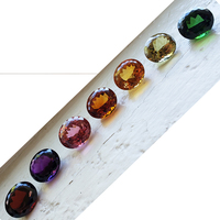 Large mixed gem suite in matched 14mm x 16mm size! This rare well cut oval  and clean gemstone set includes rhodolite garnet, amethyst, pink tourmaline, madiera citrine, golden citrine, yellow beryl and green tourmaline. These mixed gems range in wei