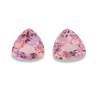Pair of trillion baby pink sapphires. This lovely pair of pastel pink sapphires have a good triangle shape, clean and very lively.  This pair would be perfect as pink sapphire side stones.